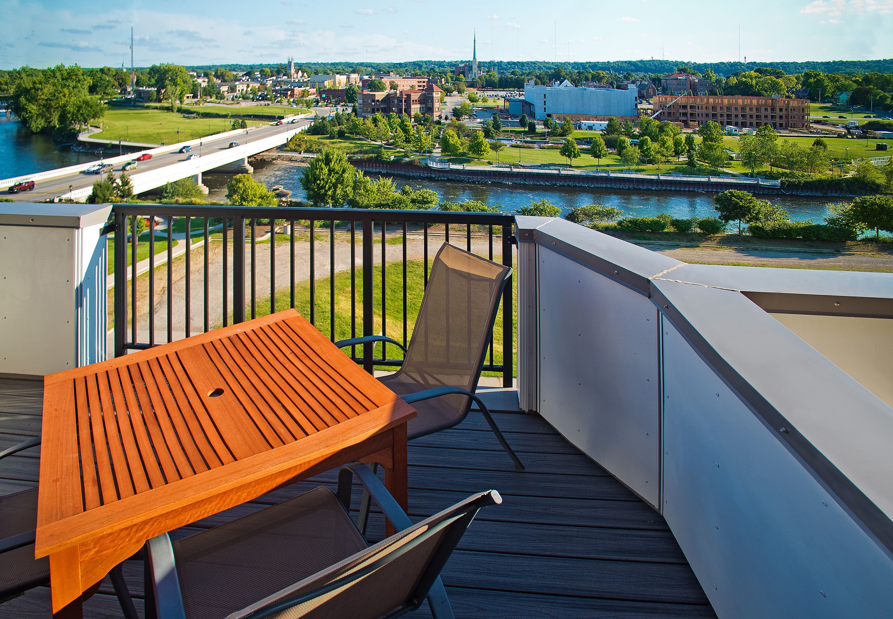 The riverfront elevation — balconies stepping along the podium edge above the St. Joseph River.